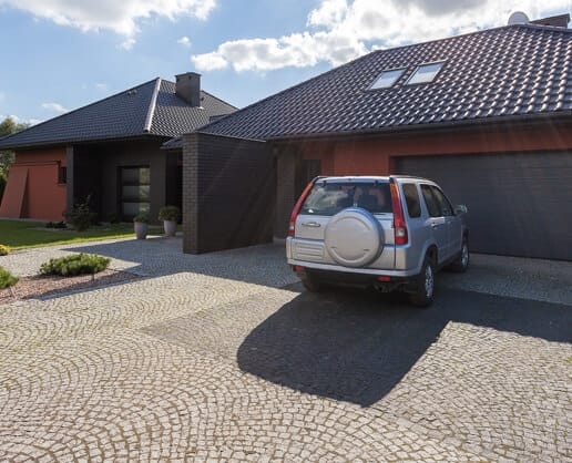 Car parked in driveway of house