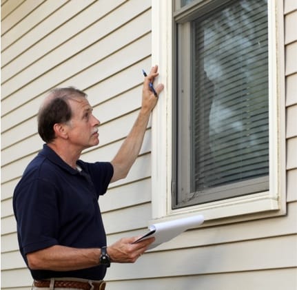 ADT technician inspects home