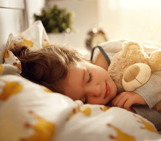 little girl sleeping with teddy bear