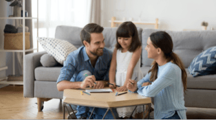 Image of family playing games in living room