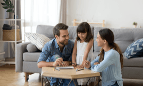 Image of family playing games in living room