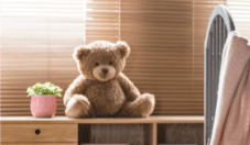 Teddy bear sitting on shelf